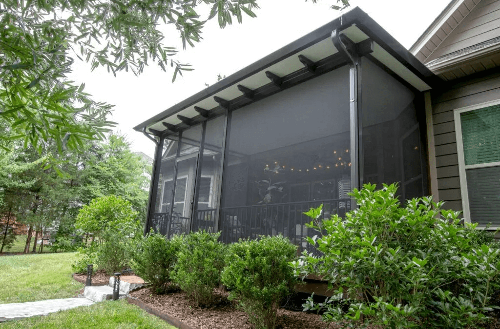 Screened-in porch with a view of the backyard.
